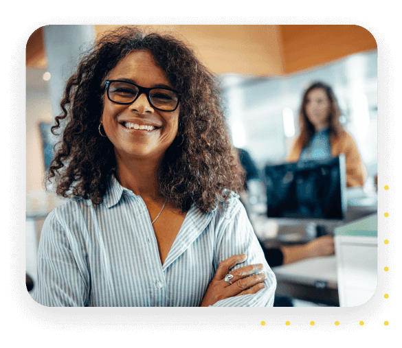 Confident business professional smiling in a modern office environment, representing expertise and leadership in human resources and payroll solutions.